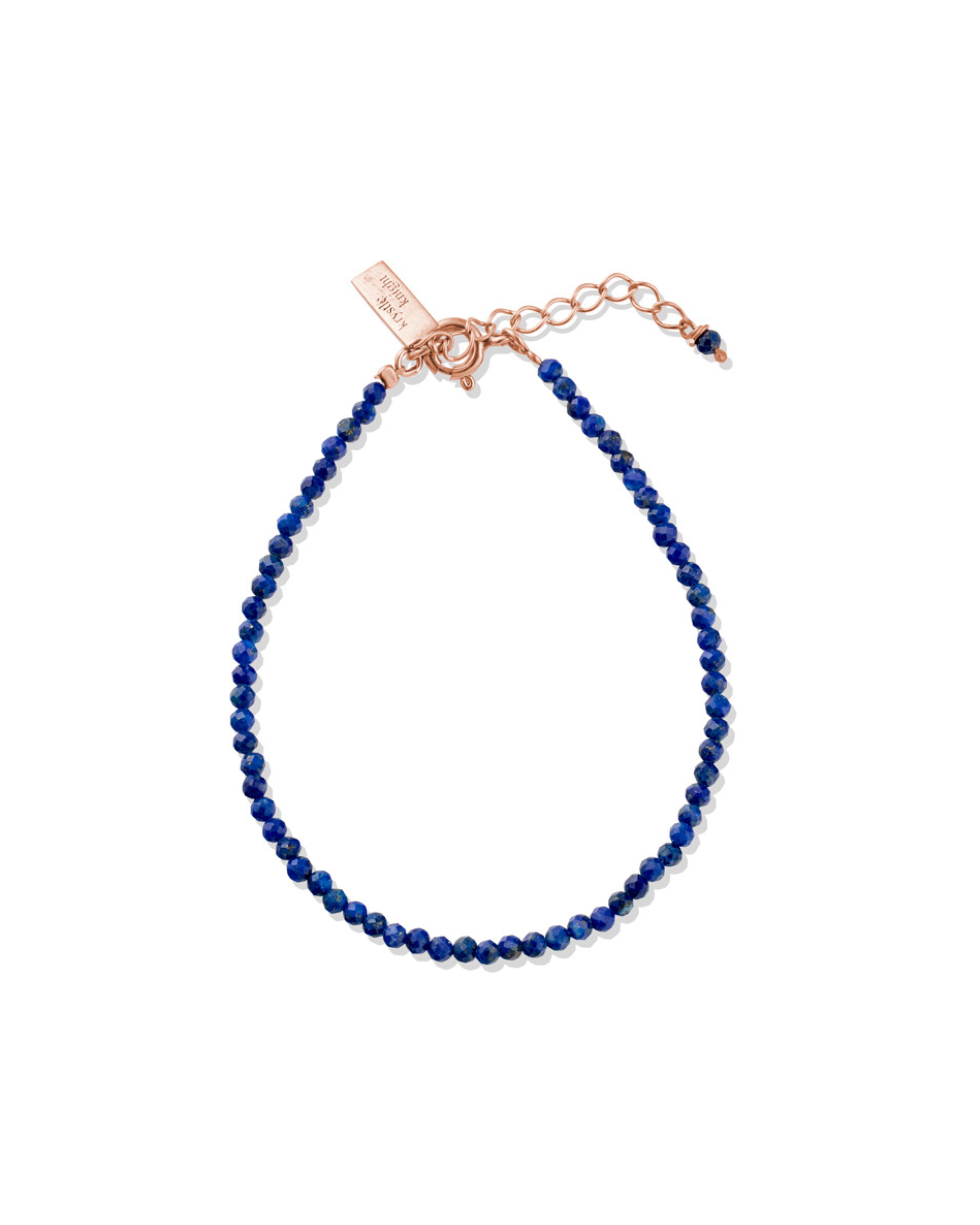 Lapis Lazuli beaded bracelet with rose gold clasp on a white background