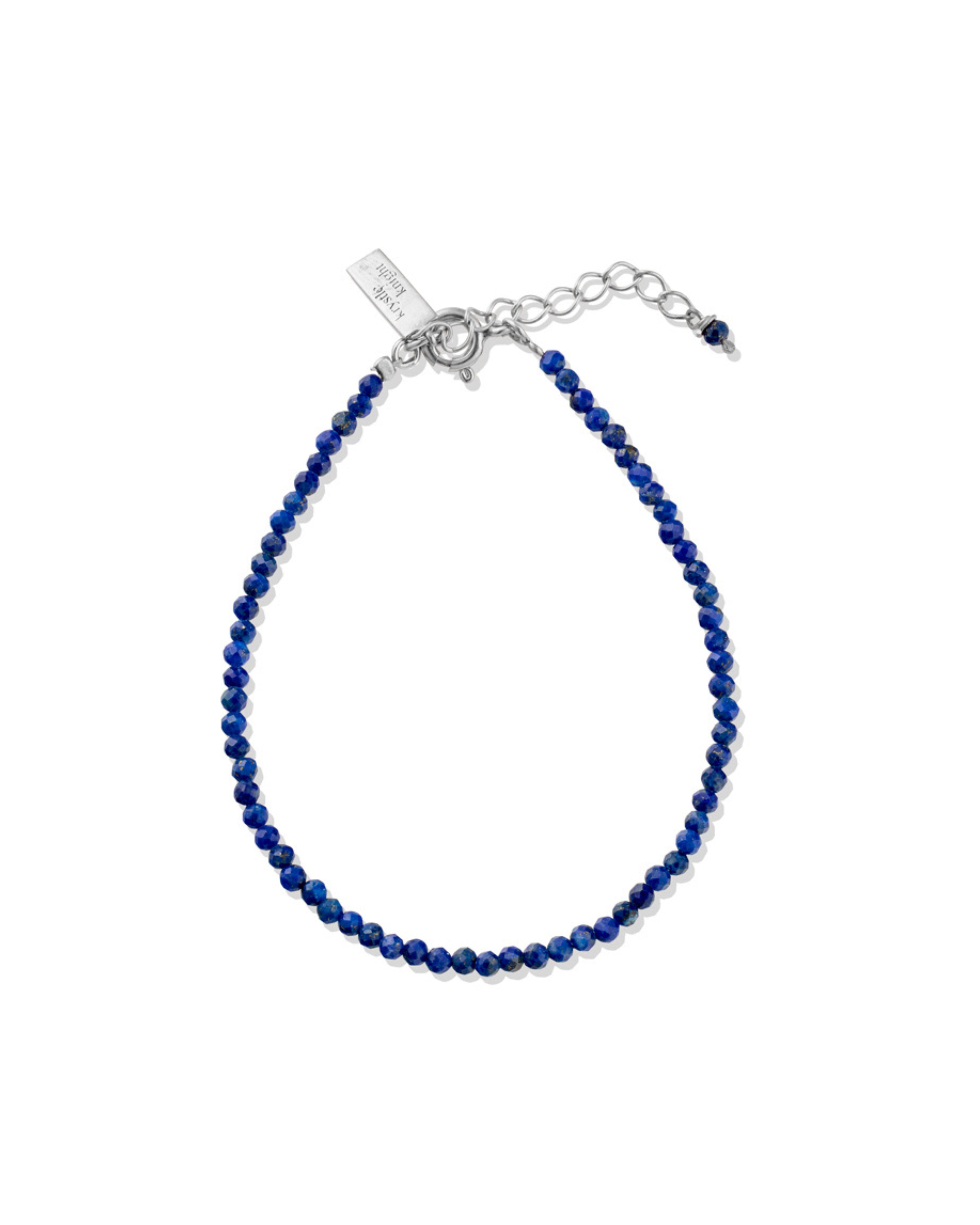 Lapis Lazuli beaded bracelet with silver clasp on a white background
