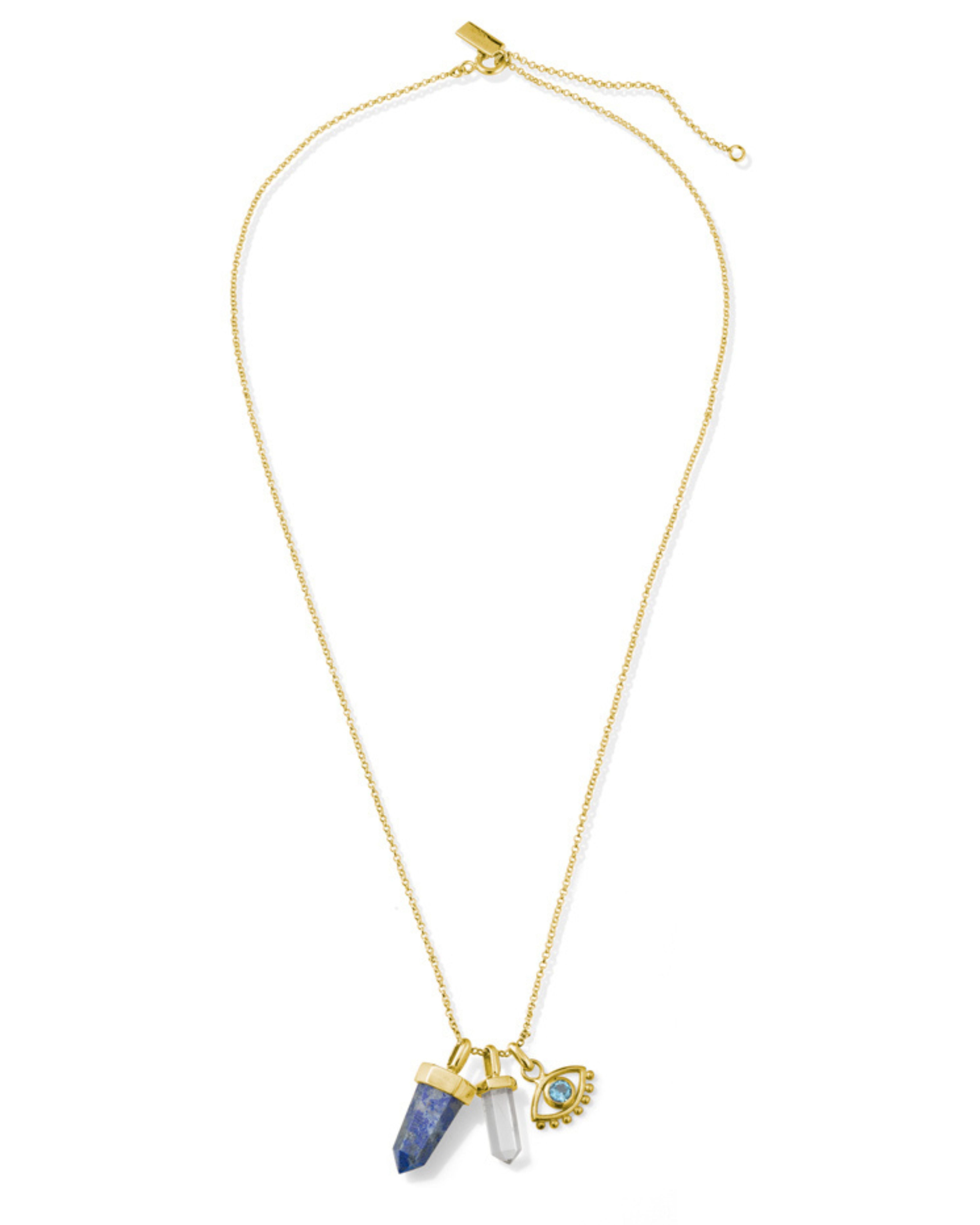 Necklace with gold chain, blue pendant, and clear crystal on a white background