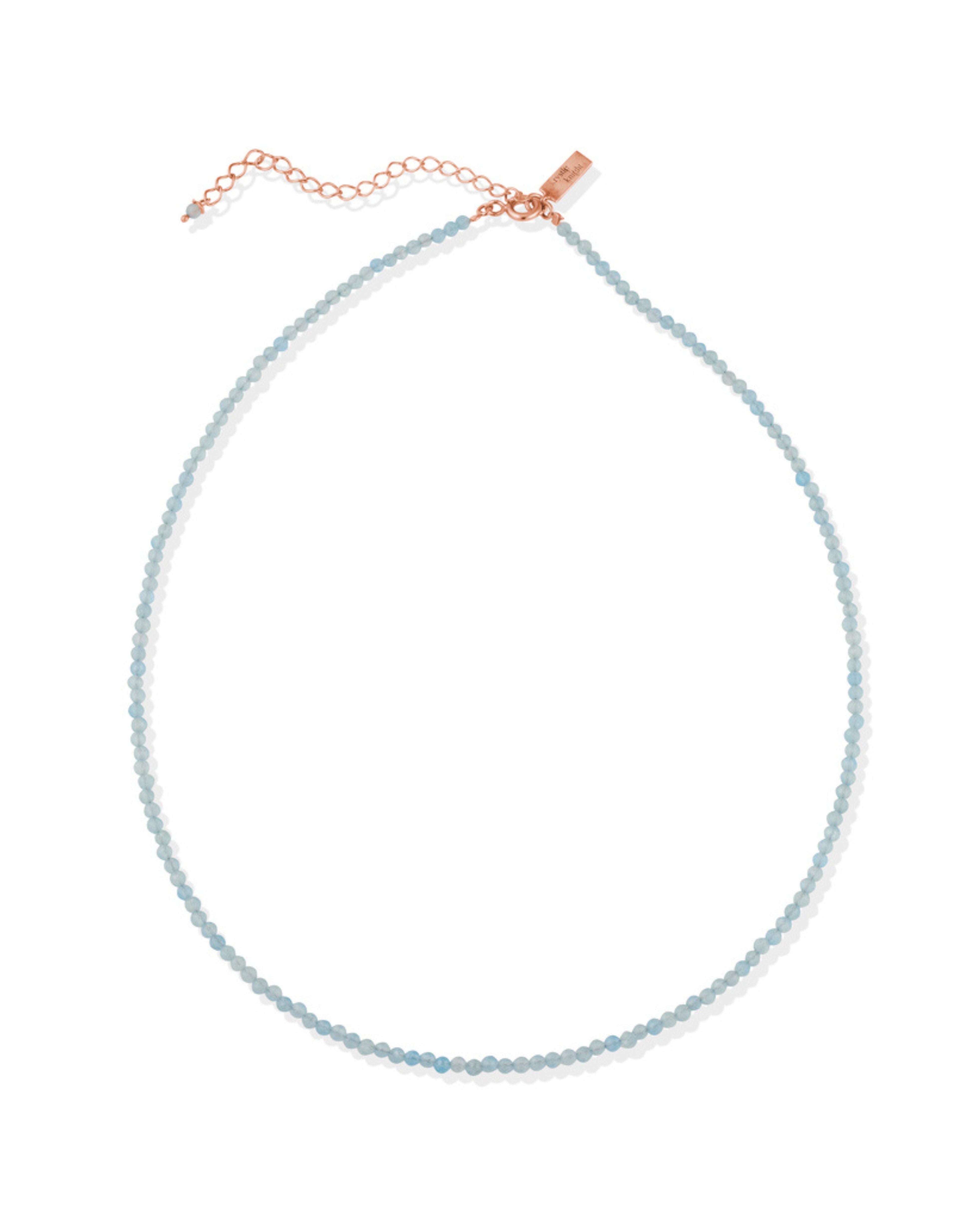 Necklace with Aqua Marine beads and rose gold clasp on a white background