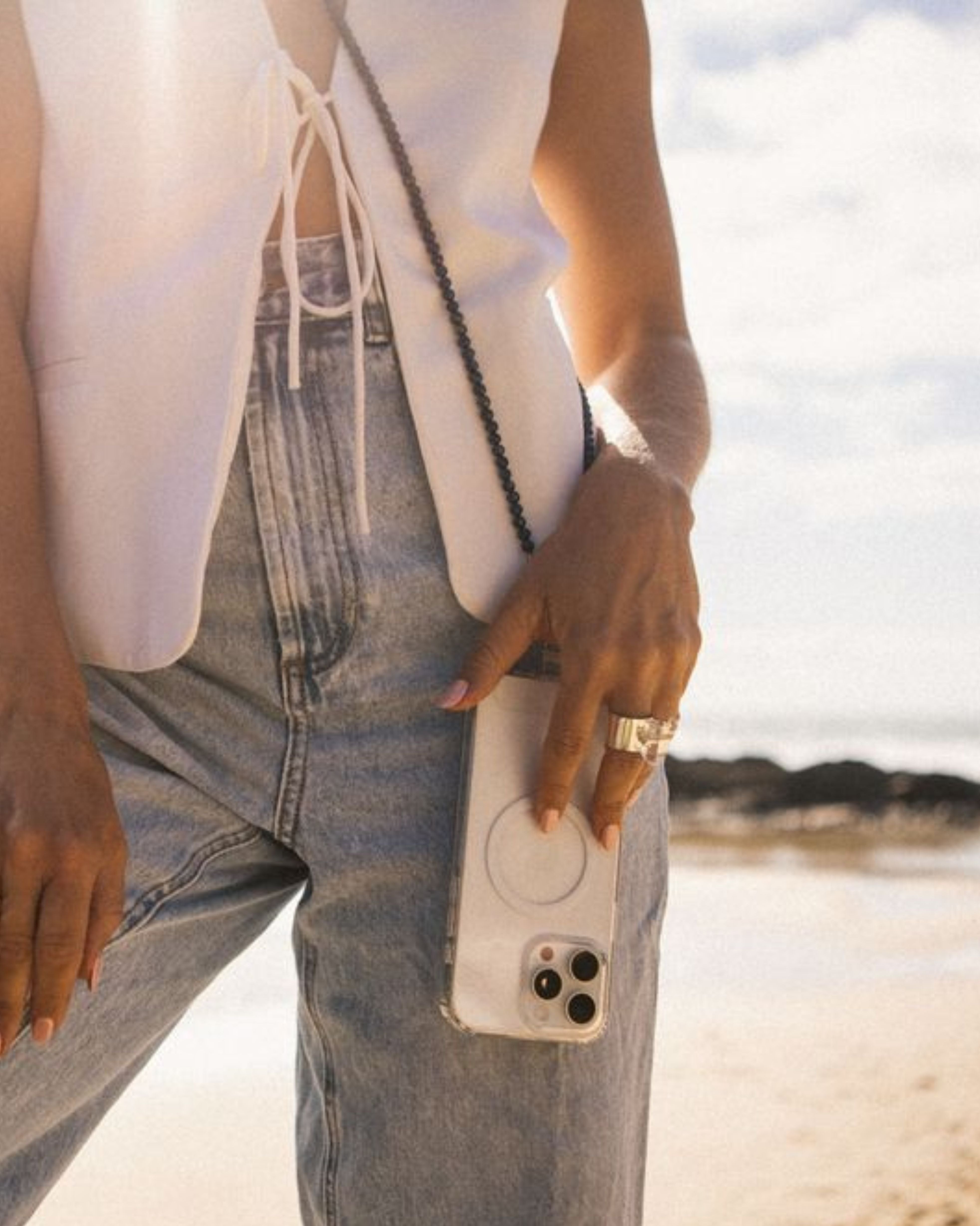 Girl in Jeans & White Top with Phone Carrier