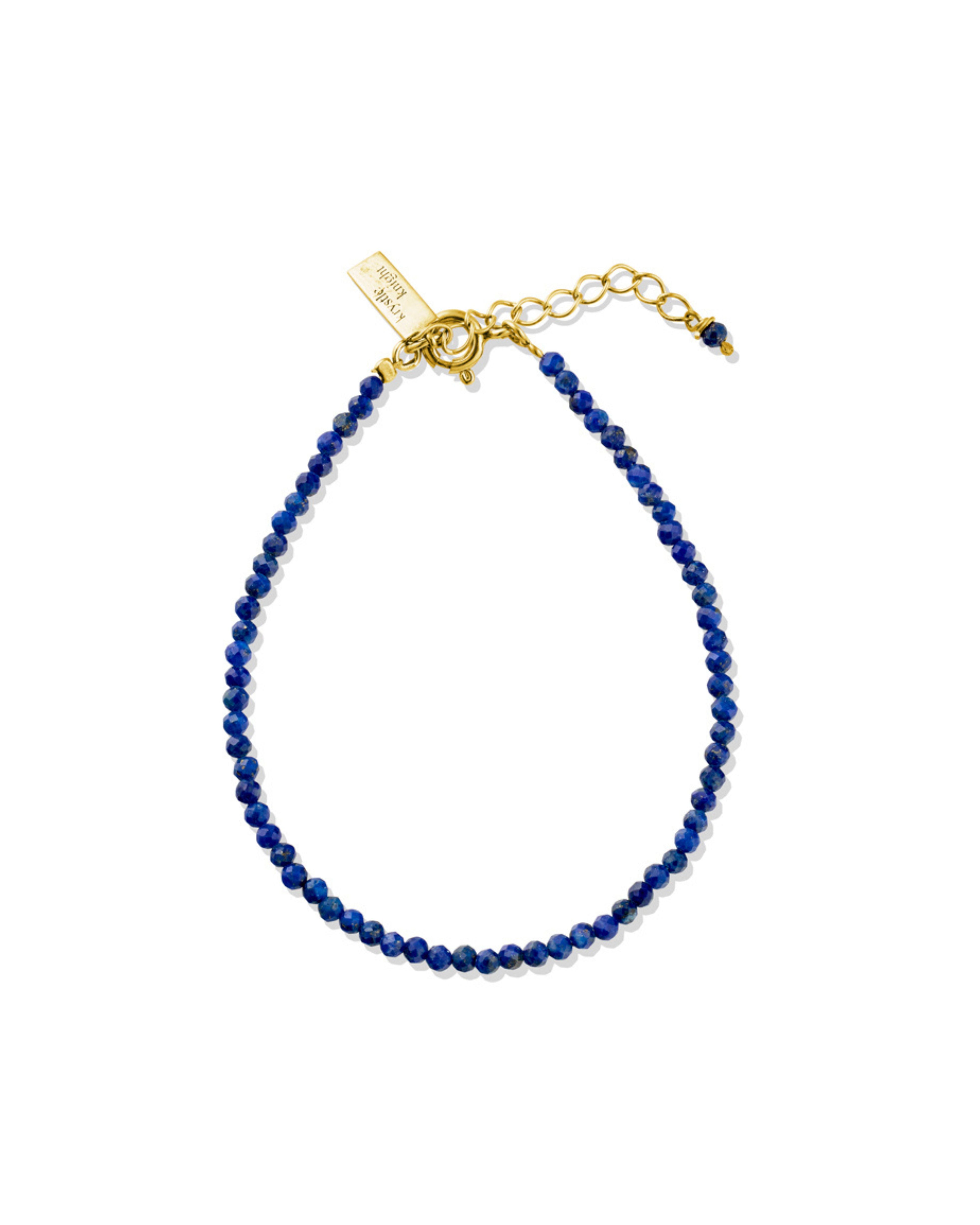 Lapis Lazuli beaded bracelet with gold clasp on a white background